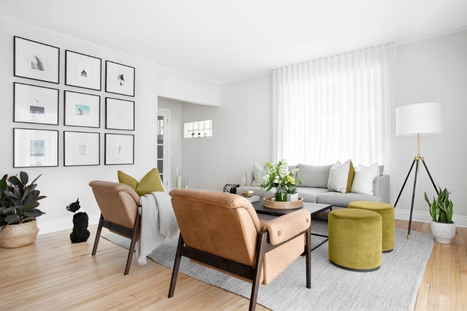 Living room with a natural color palette including gray, beige, green, and brown